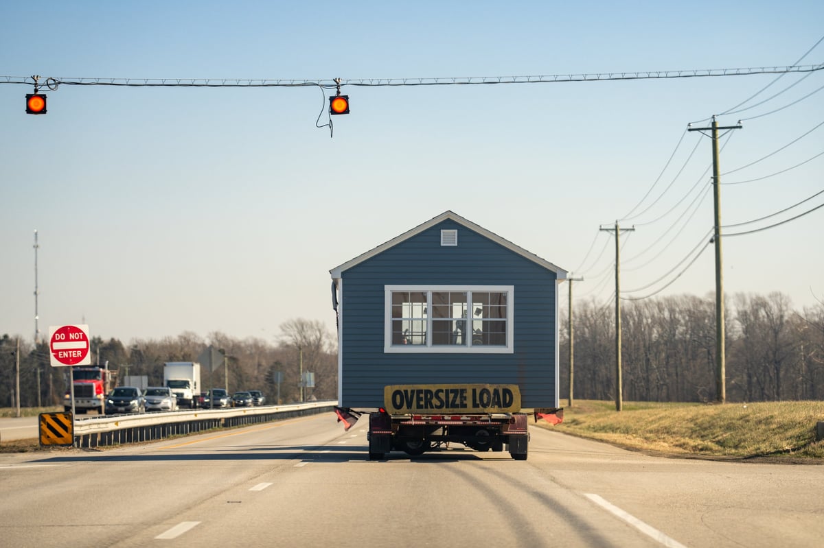 Manufactured home being transported on the highway as an oversize load